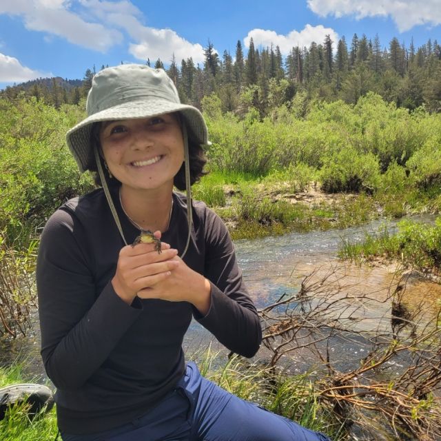 Image of Olivia holding a frog